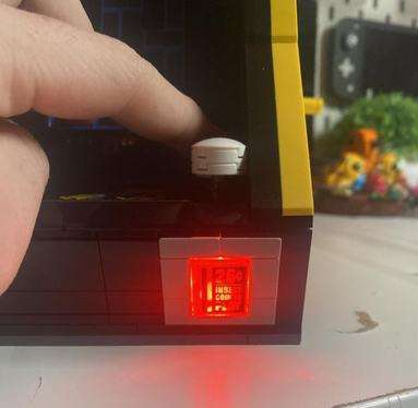 Close up image of the lit up coin slot section of the set