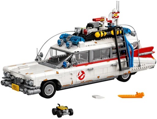 A detailed image of the LEGO Ghostbusters Ecto-1 set, showcasing the iconic vehicle from the Ghostbusters films. The model includes authentic features such as the Ghostbusters logo on the doors, the Ecto-1 New York license plate, and various ghost-hunting equipment mounted on the roof.