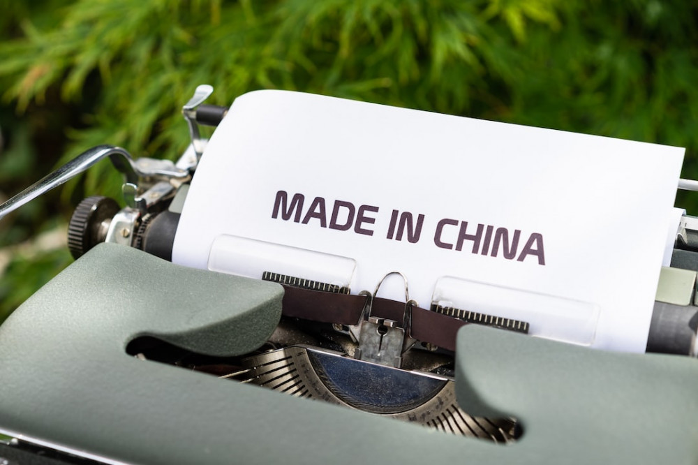 Photo of an old typewriter with the typed words Made in china on a sheet of paper. 