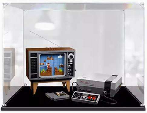 ORANGES Acrylic Display Box protecting and showcasing the LEGO Super Mario Nintendo Entertainment System, ensuring it remains dust-free and prominently displayed.