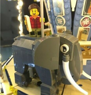 Close up image of minifigure with animal going on a ride