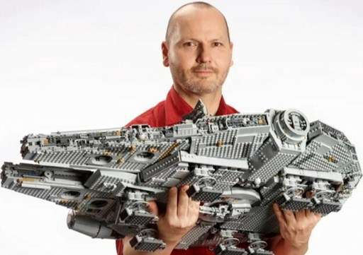 Image of man holding the LEGO Ultimate millennium Falcon set 75192. Link to Amazon.