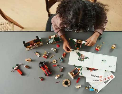 Young girl assembling the Lego Ninjago Creative Brick Box set. Link to amazon.