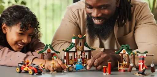 Image of an adult playing with the Lego ninjago Creative Brick Box set, alongside  a young girl. Link to Amazon.