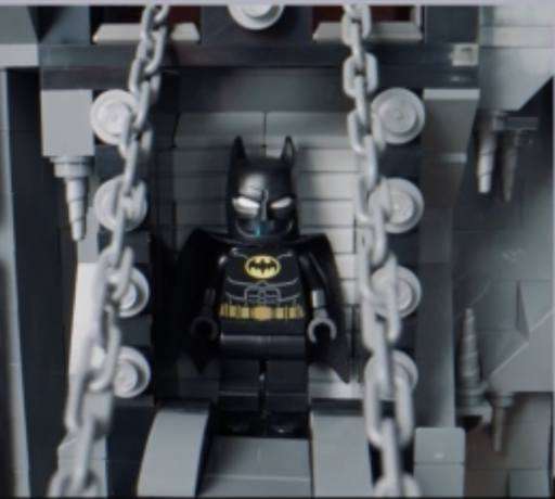 Image of Batman’s hidden lair in the set with Batman inside with the trapdoor opened.