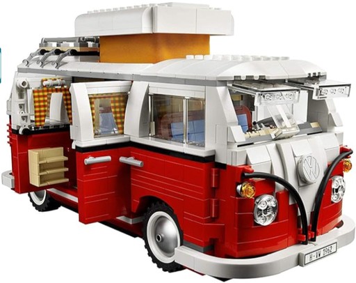 The LEGO Creator Volkswagen T1 Camper Van 10220 features a detailed red and white exterior with a functional interior, including a transforming bench seat and engine details, designed for adult collectors. Image links to Amazon marketplace.